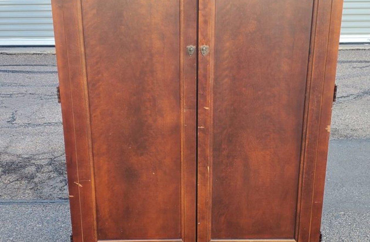 Cherry wood double door armoire wardrobe with crown molding and bracket feet