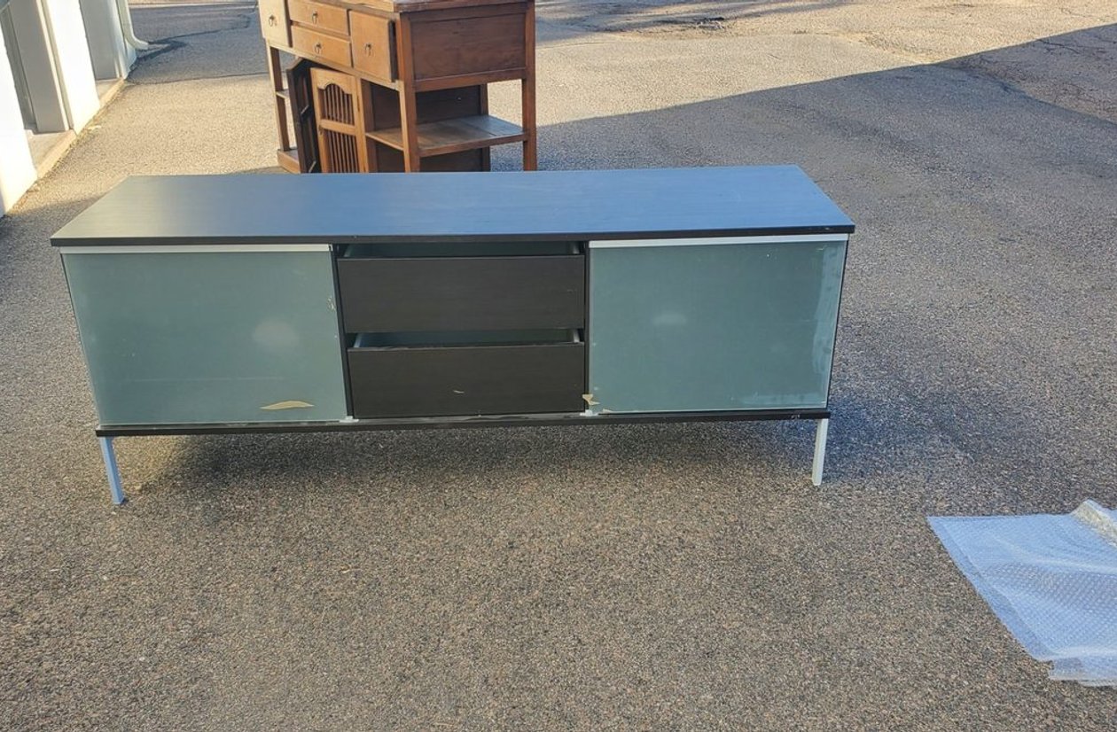 Modern black media console TV stand with frosted glass sliding doors and chrome legs